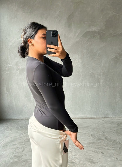 Bodysuit manga larga y cuello redondo