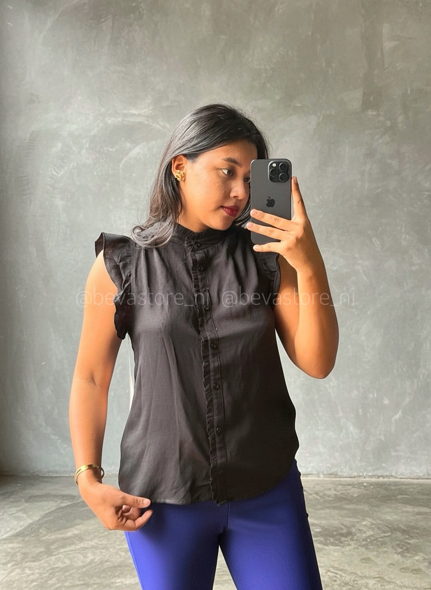 Blusa abotonada con volantes